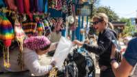 Interacting with a local shopkeeper along the Annapurna trail |  <i>Joe Kennedy</i>