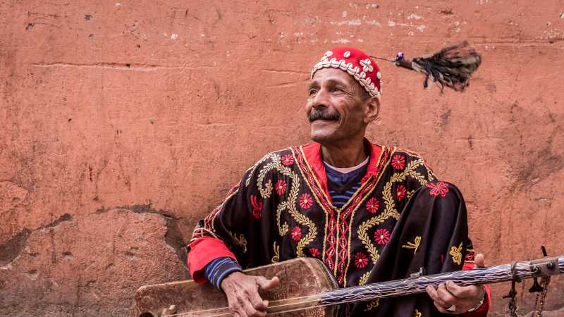 Musician plying his trade in the medina, Marrakesh | Richard I'Anson