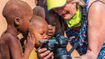 Local Himba children fascinated with the camera