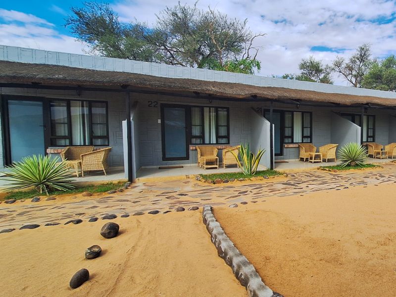 Standard rooms at Brandberg White Lady Lodge, stone patios in the Namibian desert