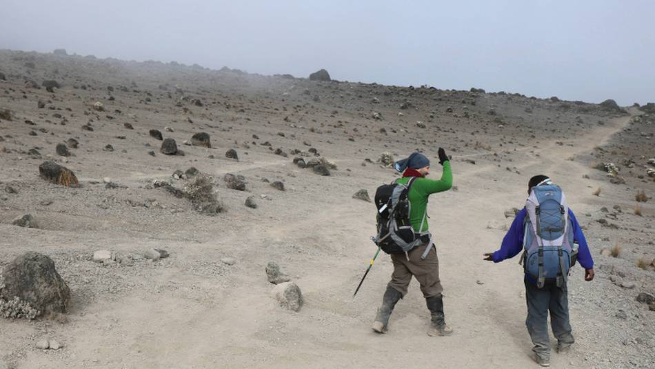 Walking the dusty landscape en-route to the summit of Kilimanjaro | Kyle Super