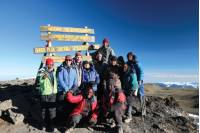 Trekkers and guide group on Kilimanjaro Uhuru Summit |  <i>Kyle Super</i>