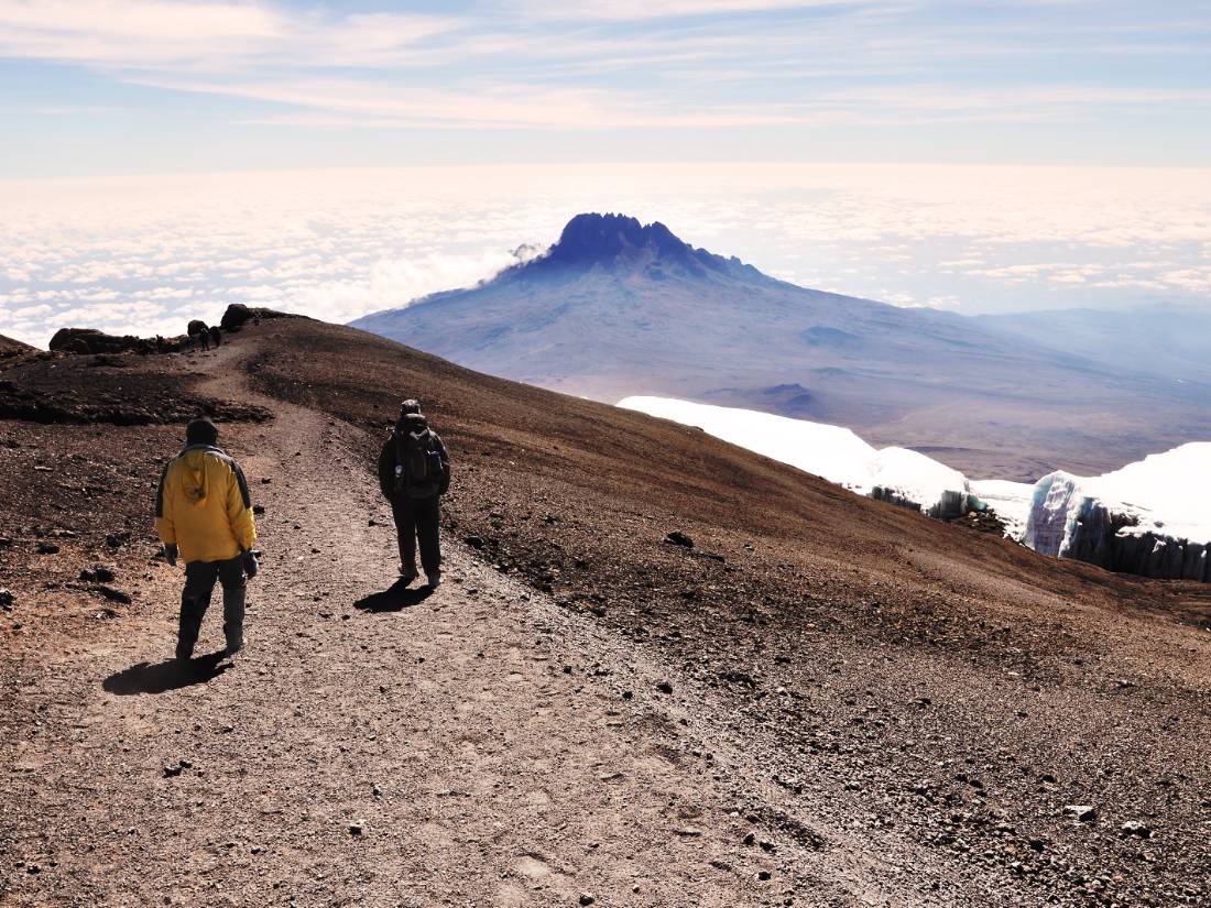 Trekkers descending Mount Kilimanjaro |  <i>Peter Brooke</i>