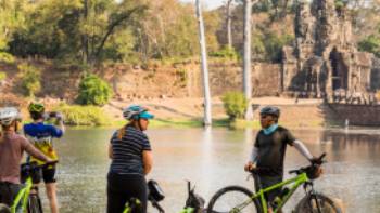 Cycling is a great way to take in even more of the ruins of Angkor Wat