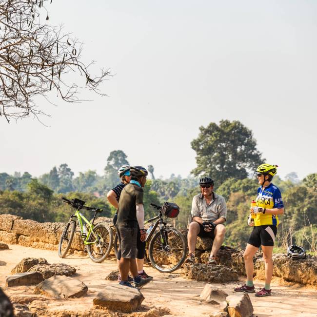 The local guide sharing stories during the exploration of the Angkorian ruins | Lachlan Gardiner