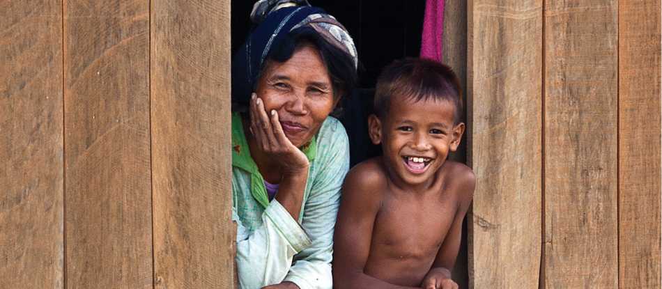 Relaxed Mother and Son onlooking the streets of Cambodia | Peter Walton