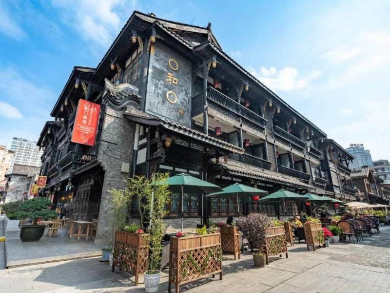 Buddha Zen Hotel, Chengdu: A traditional Chinese building with carved wooden balconies and a peaceful courtyard, offering a serene retreat in the city.