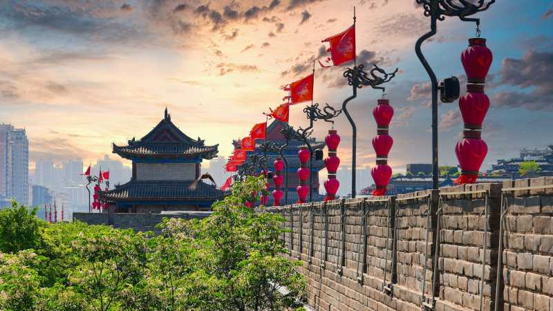 The ancient stone wall and watchtower adorned with red lanterns in Xi'an - Premium China: Natural Wonders & Cultural Highlights, China