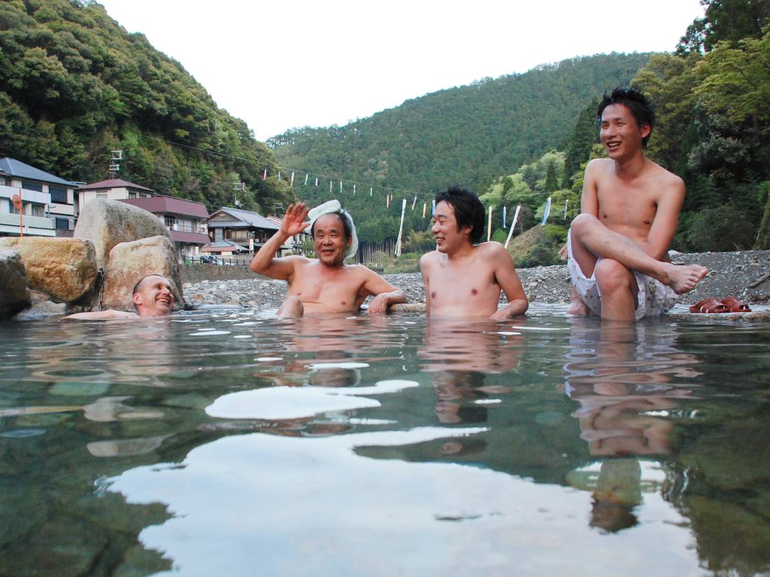 Bathers enjoying the hot spring waters at Kawayu Onsen