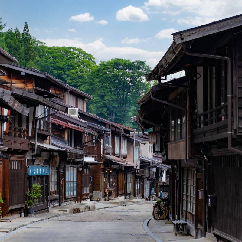 Nakasendo Trail hiking path lined with traditional wooden buildings in Japan