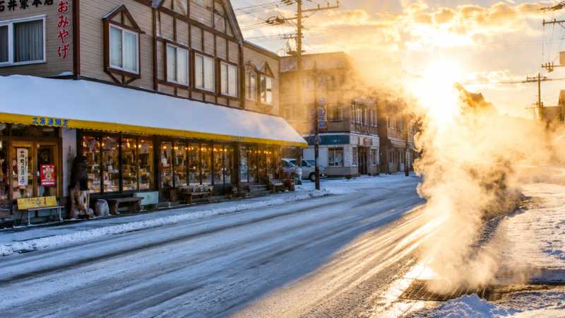 Steam-filled street is located in Kawayu Onsen, a historic hot spring town in Teshikaga - Hokkaido Winter Explorer, Japan
