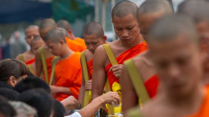 The centuries old daily Alms giving ritual, Tak Bat.