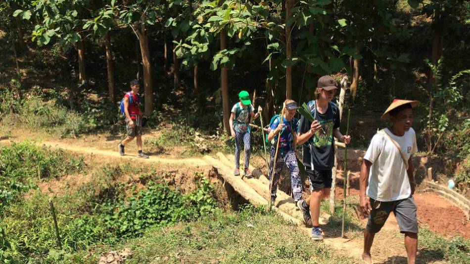A family following our local hiking guide in Laos | Kate Harper