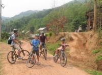 Family group cycling in Northern Laos -  Photo: Kate Baker