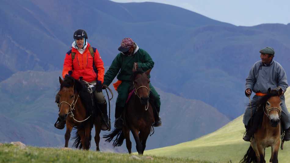 On horseback in a remote river valley in Mongolia