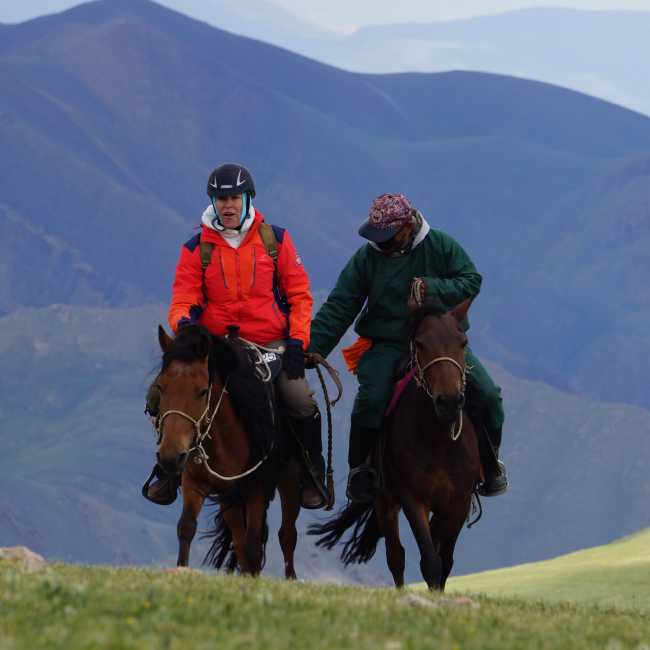 On horseback in a remote river valley in Mongolia
