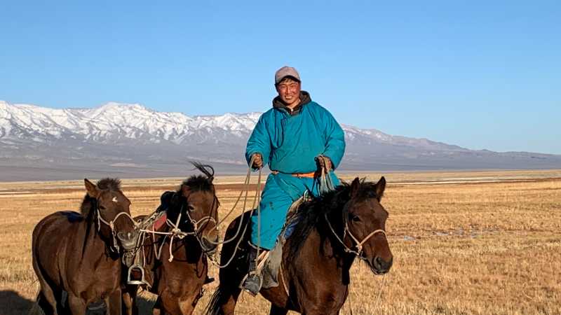 Our local herders help manage the horses during our trek to Tsast Bogd Mountain | Tim Cope