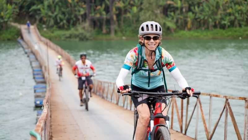 Cycling on an e-Bike across a rural bridge