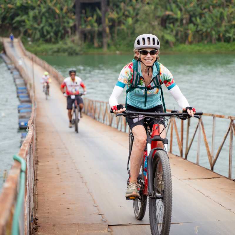 Cycling on an e-Bike across a rural bridge