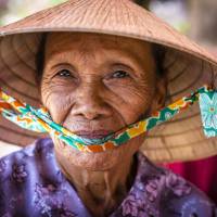 Local Vietnamese woman in her 'Non la' traditional hat | Richard I'Anson