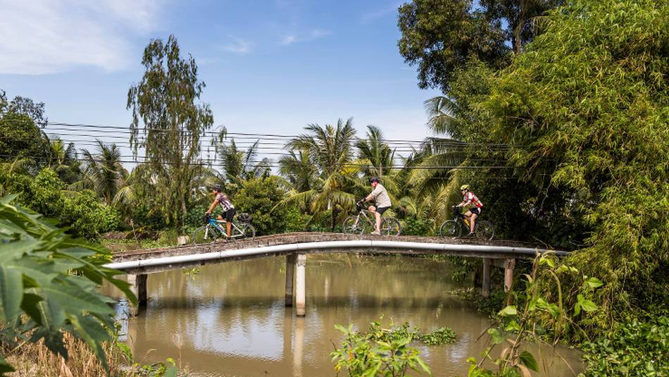 Verdant landscapes cycling along the Mekong Delta | Lachlan Gardiner