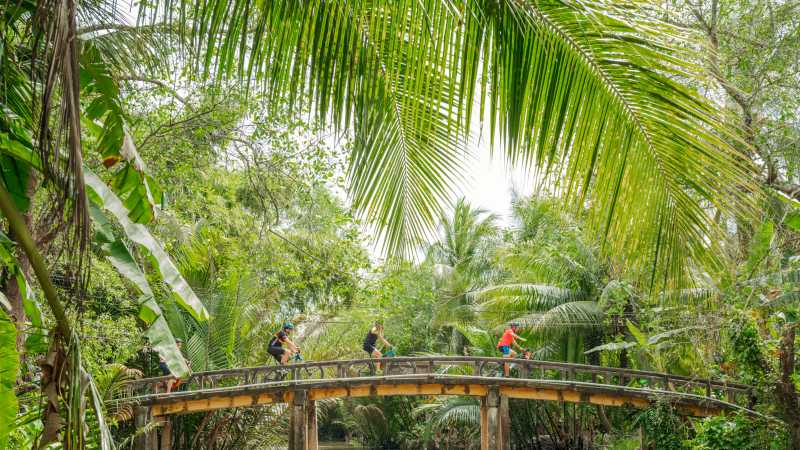 Small bridge crossing cycling through Vietnam