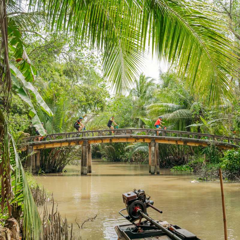 Small bridge crossing cycling through Vietnam