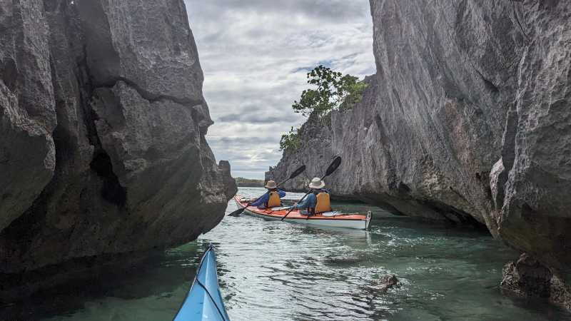 Kayakers exploring limestone channels in the Yasawa Islands
