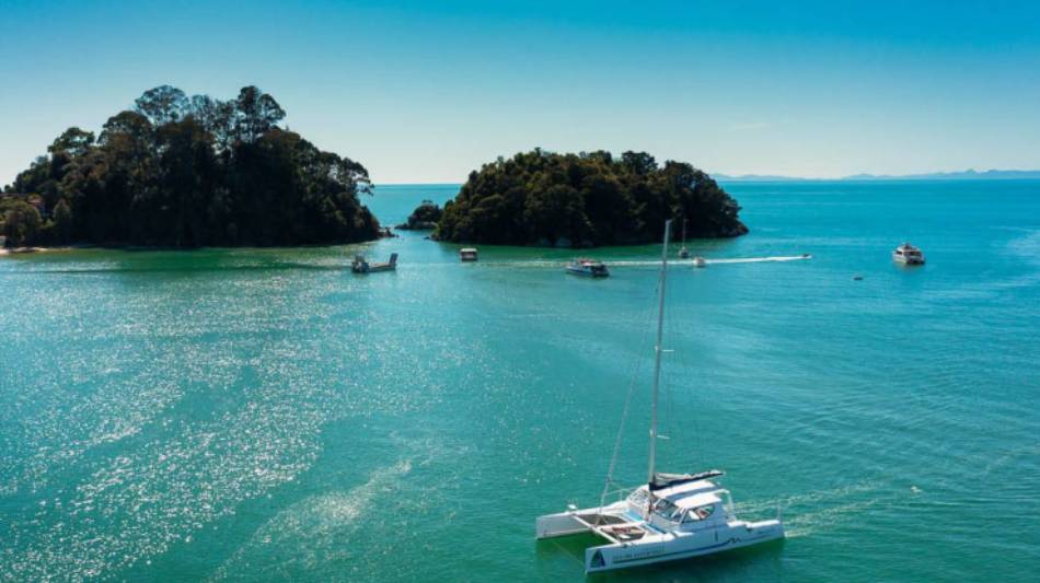 Cruising through the stunning bays of the Abel Tasman by Catamaran.