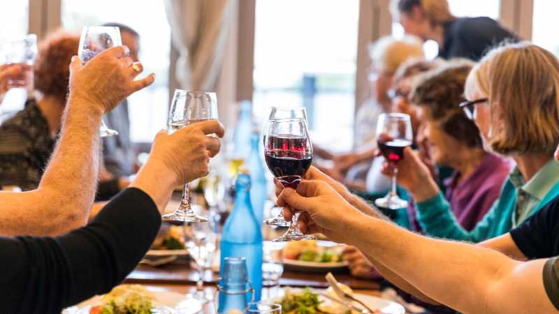 Celebrating with fine food and wine after a good day's ride | Lachlan Gardiner