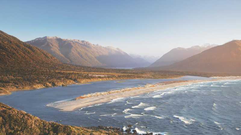 Aerial view over Long Reef and Martin's bay on the Fiordland, Hollyford and Stewart Island Trek | Hollyford Track
