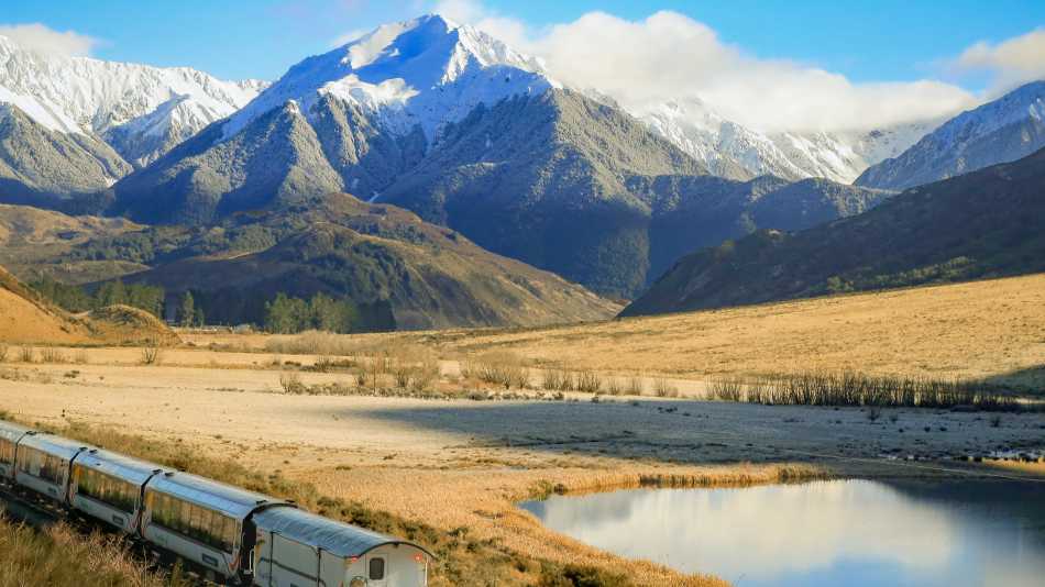 Glide through the towering Tiritiri-o-te-moana / Southern Alps aboard the TranzAlpine — a spectacular prelude to your West Coast cycling journey. | Jay French