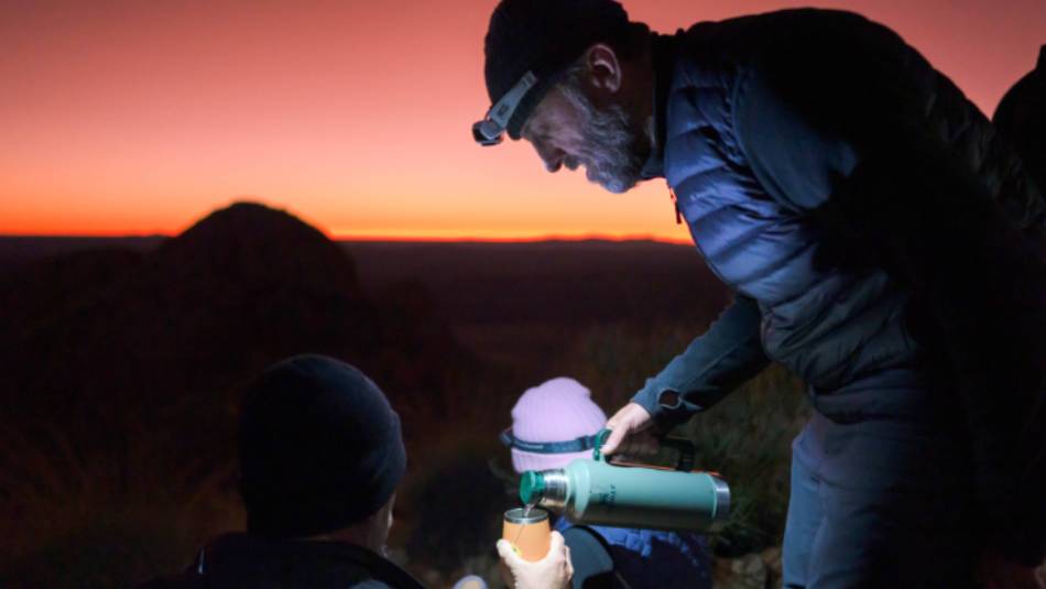 Enjoying a hot cuppa on top of Mt Sonder at sunrise | Luke Tscharke