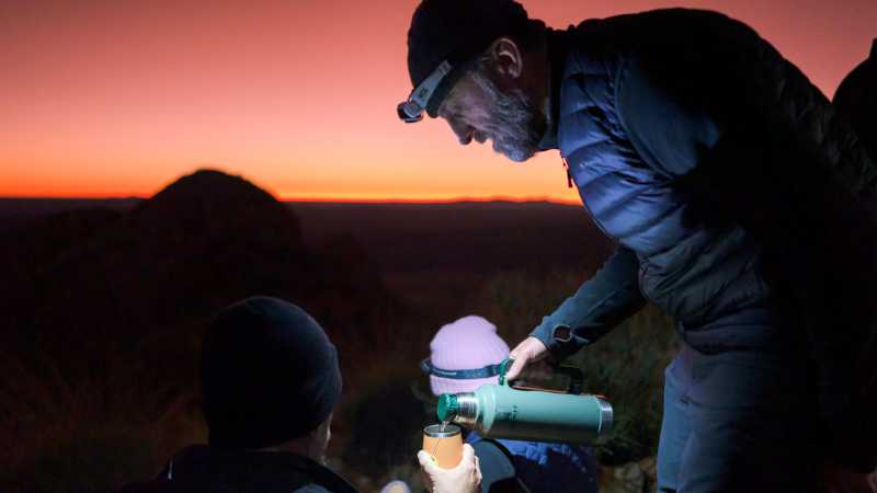 Enjoying a hot cuppa on top of Mt Sonder at sunrise | Luke Tscharke