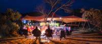Relaxing around an open fire after a day on the Larapinta Trail | Caroline Crick