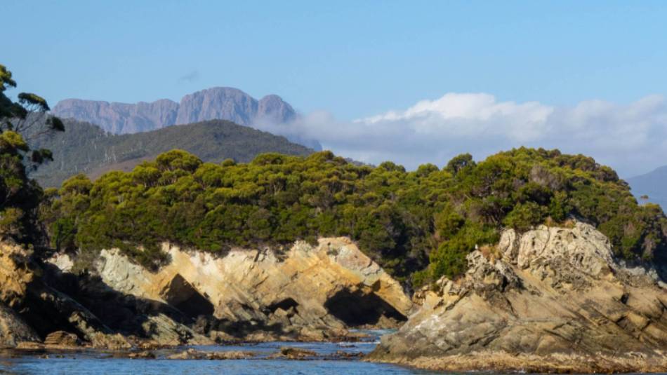 The imposing Ironbound Ranges in the distance on the South Coast Track | John Dalton
