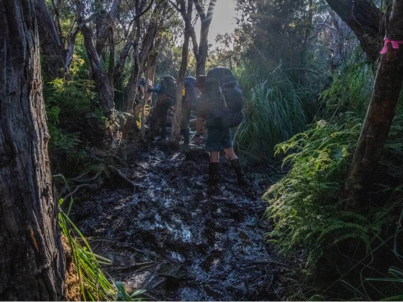 The terrain on the South Coast Track can be very muddy | John Dalton