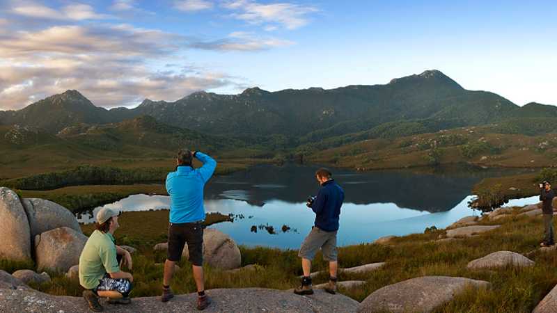 Hikers taking in the breathtaking views of Cradle Mountain and Lake St Clair | Peter Walton