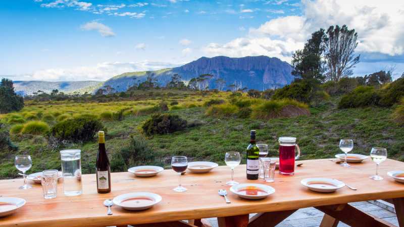 Delicious meals and wine are served each evening on the Cradle Huts walk | Great Walks of Australia