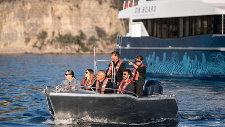 Expedition vessel Odalisque and guests in one of two excursion tenders