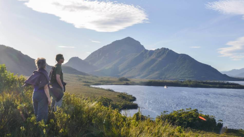 Guests admire Odalisque on her mooring & Mt Rugby