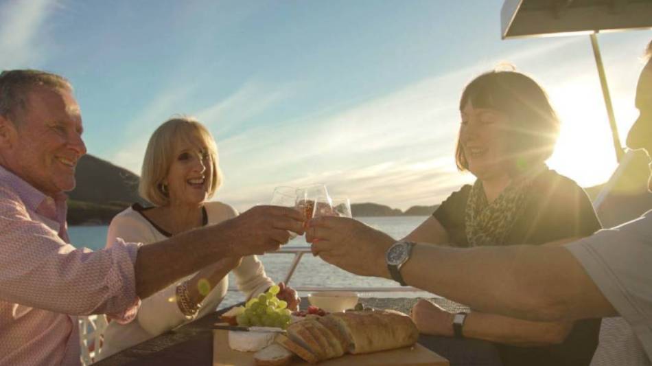 Guests enjoy sunset drinks aboard Odalisque