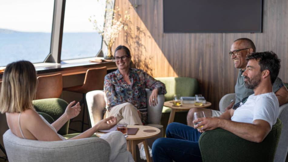 Guests relaxing in expedition vessel Odalisque's Wheelhouse Lounge & Bar