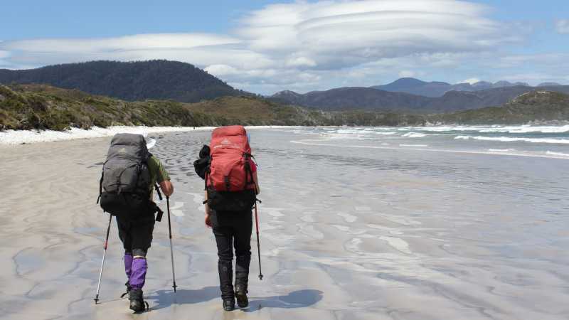 A couple treks the remote beaches along the South Coast Track | Phil Wyndham