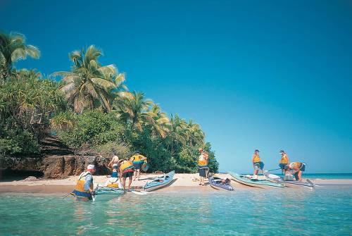 Kayakers taking a break on a quiet beach along the Tongan coastline