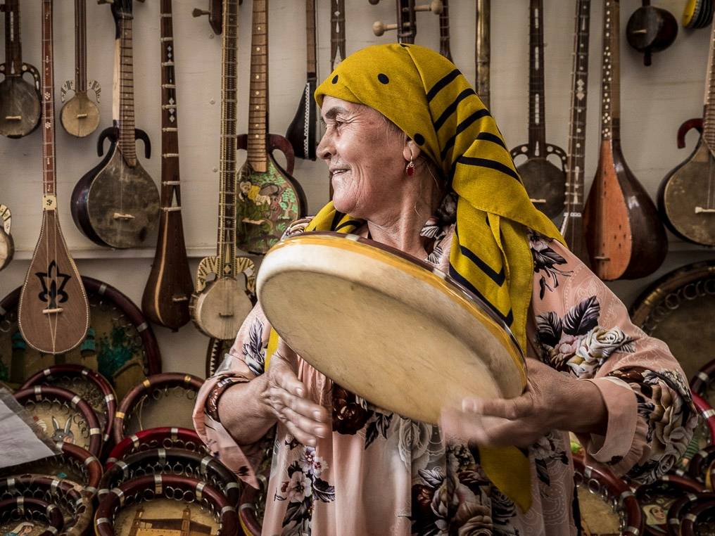 Woman playing traditional instrument, Bukhara, Uzbekistan |  <i>Richard I'Anson</i>