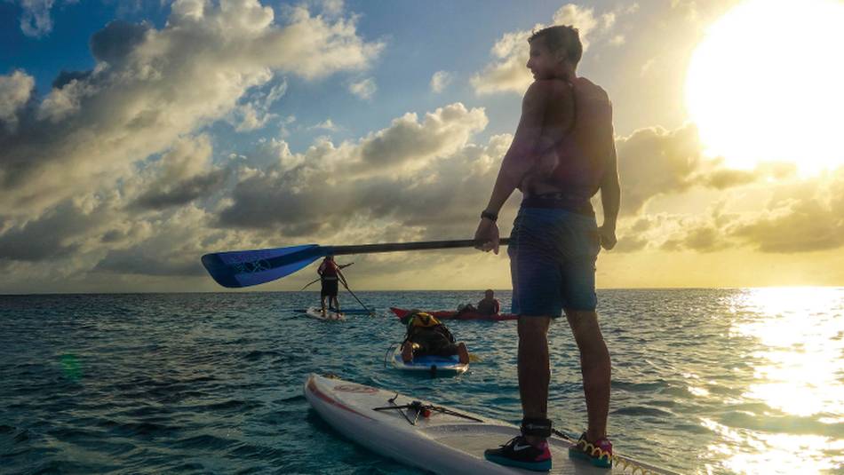 Stand up paddle boarding in the warm waters of Lighthouse Reef