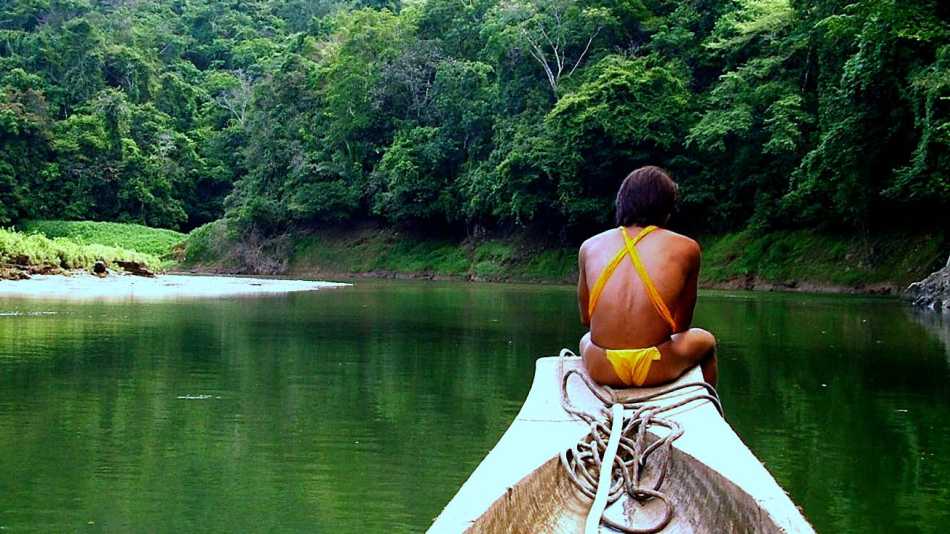 The Embera Tribe use dugout canoes to slice up river to their Indigenous Village
