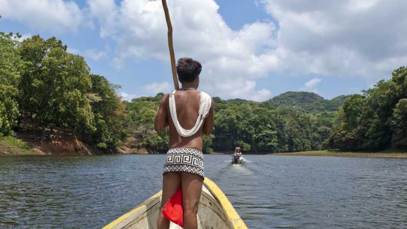 Traditional Embera Indian on a long boat in Panama