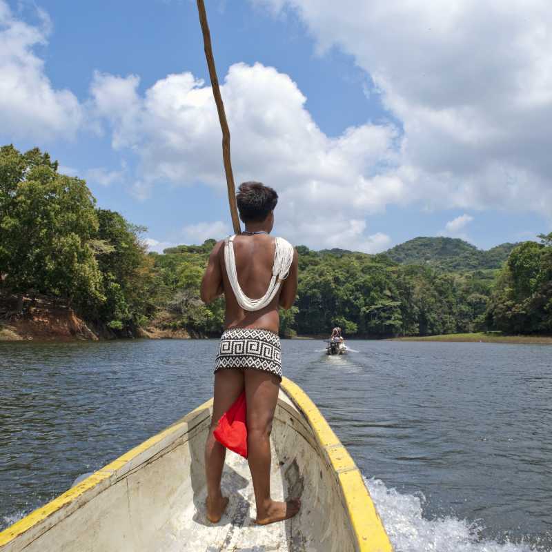 Traditional Embera Indian on a long boat in Panama